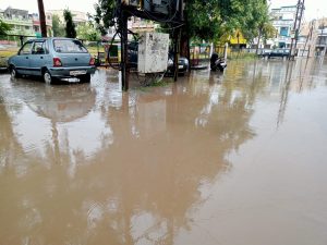 City drenched by drizzling rain, water filled in houses and shops, jam in the way of colonies